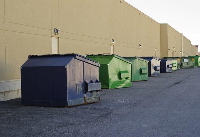 dumpsters with safety cones in a construction area in Burbank